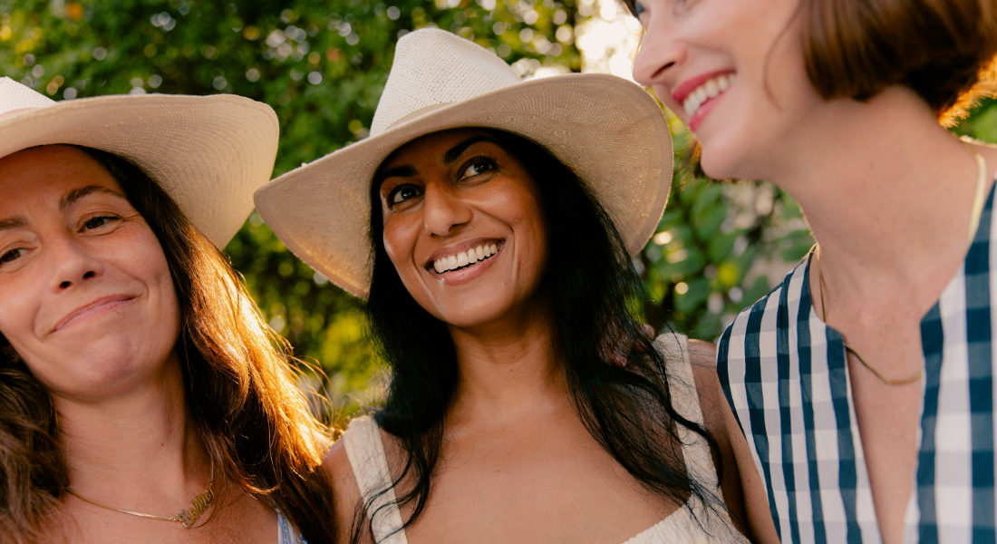 Three women smiling together